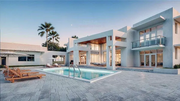 a house with lots of trees in front of it