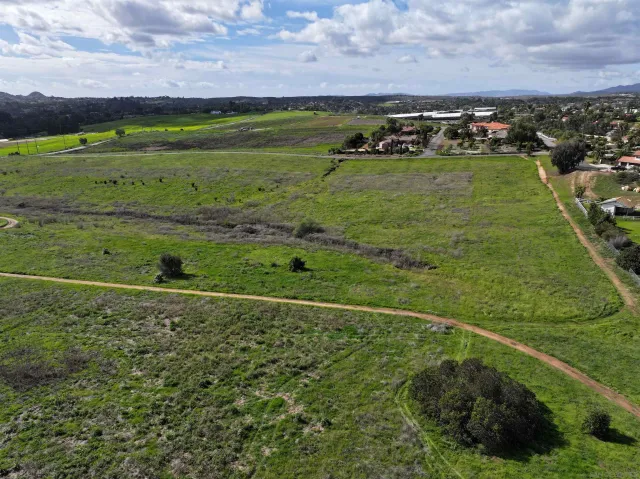 a view of a field with an ocean