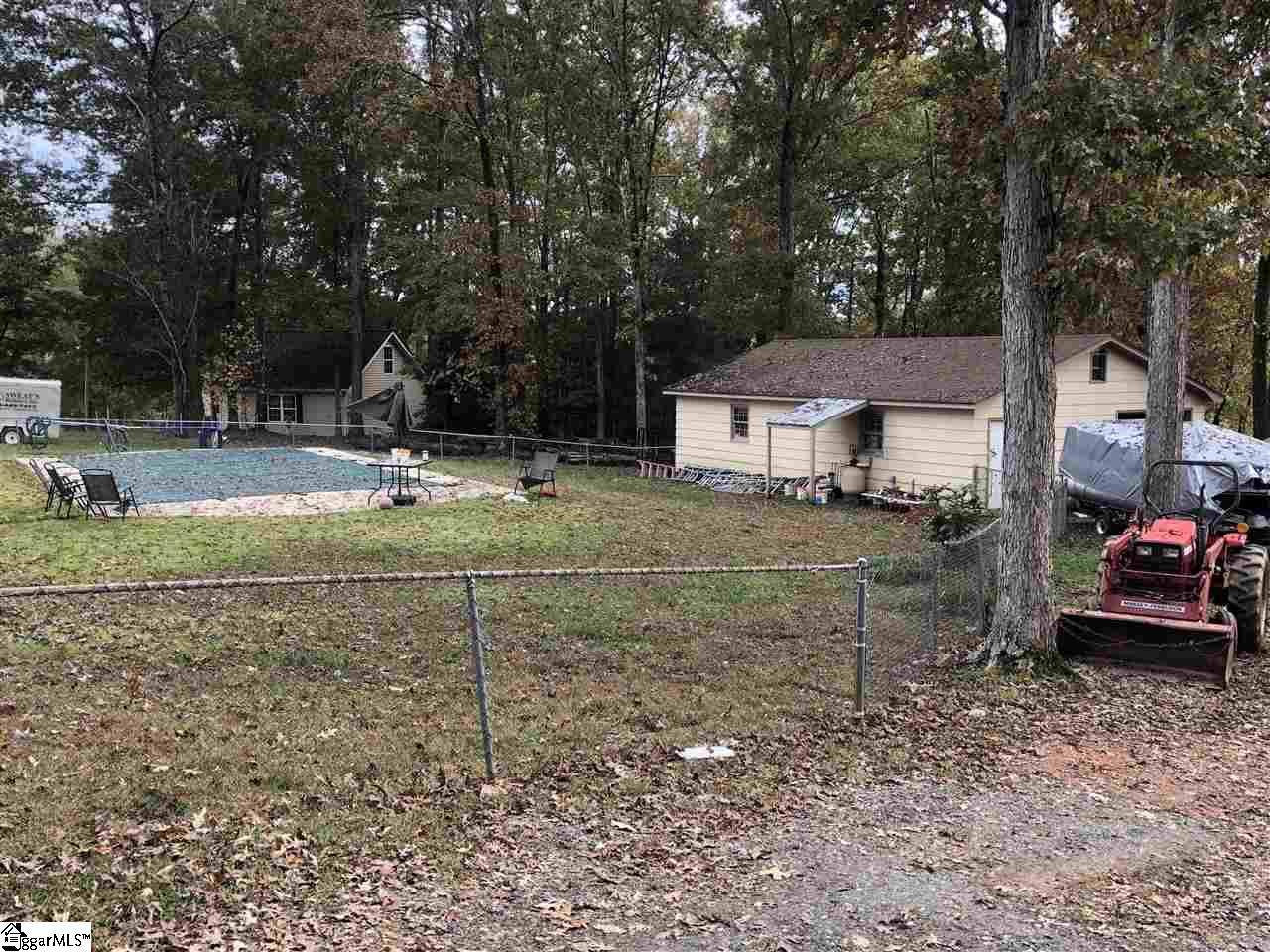 3003 East Georgia Road Simpsonville, SC 29681 - Photo 2 of 12 Large fenced in back yard with in-ground concrete swimming pool with safety cover.
