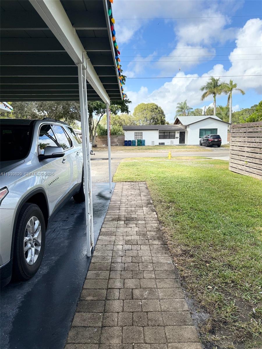 5280 Southwest 92nd Terrace Cooper City, FL 33328 - Photo 14 of 50 a view of a back yard of the house with a car parked