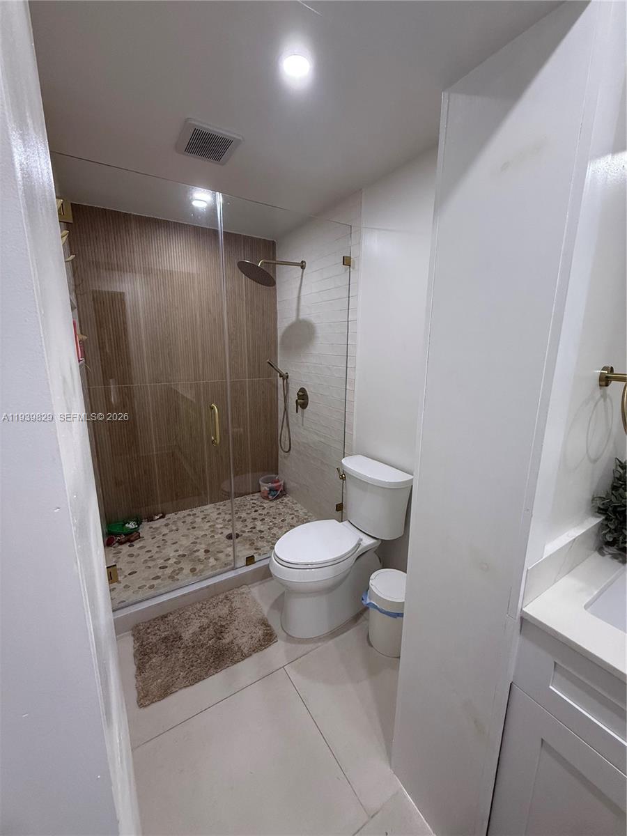 5280 Southwest 92nd Terrace Cooper City, FL 33328 - Photo 24 of 50 a bathroom with a toilet a sink and shower