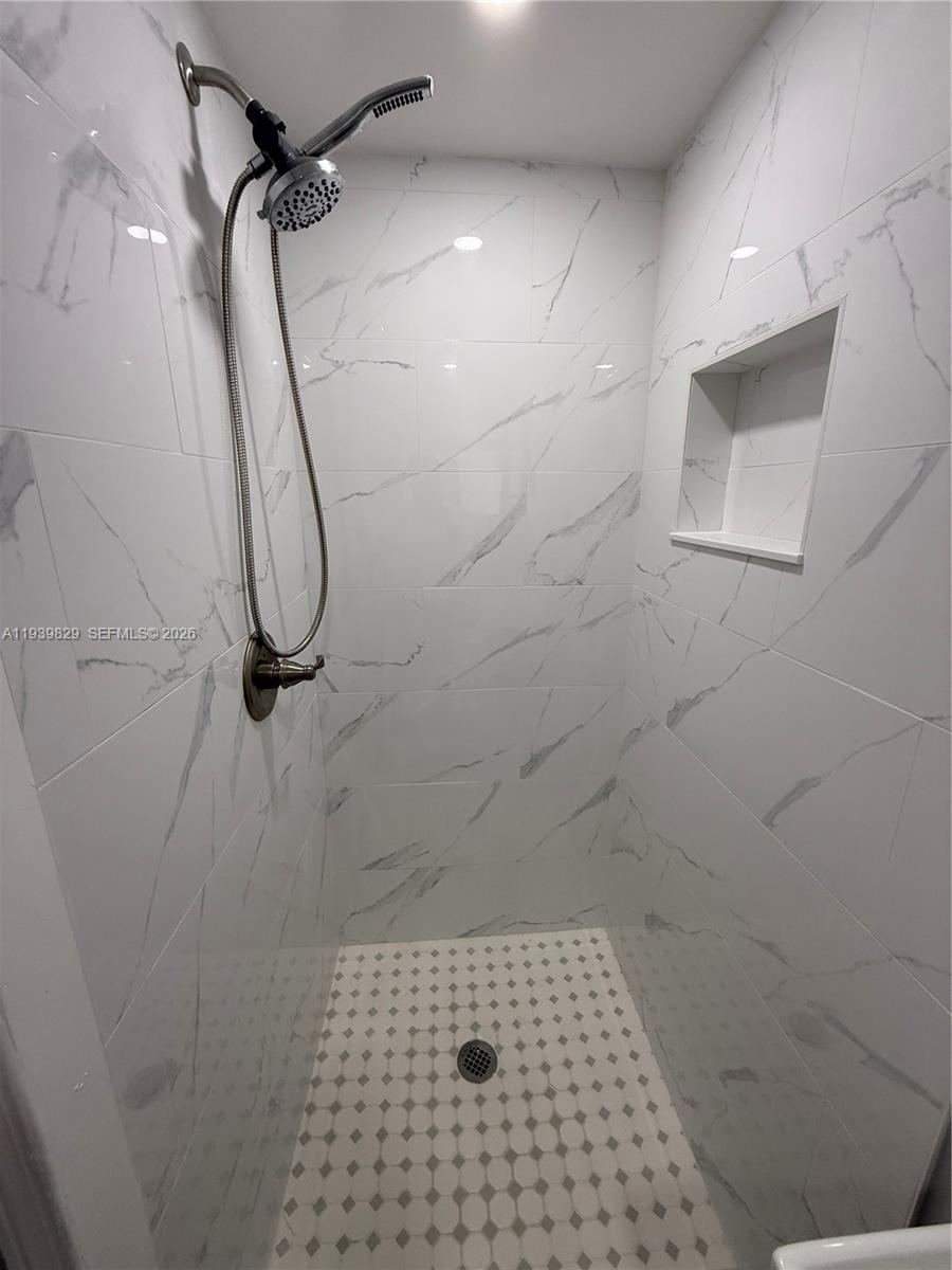 5280 Southwest 92nd Terrace Cooper City, FL 33328 - Photo 27 of 50 a bathroom with a shower