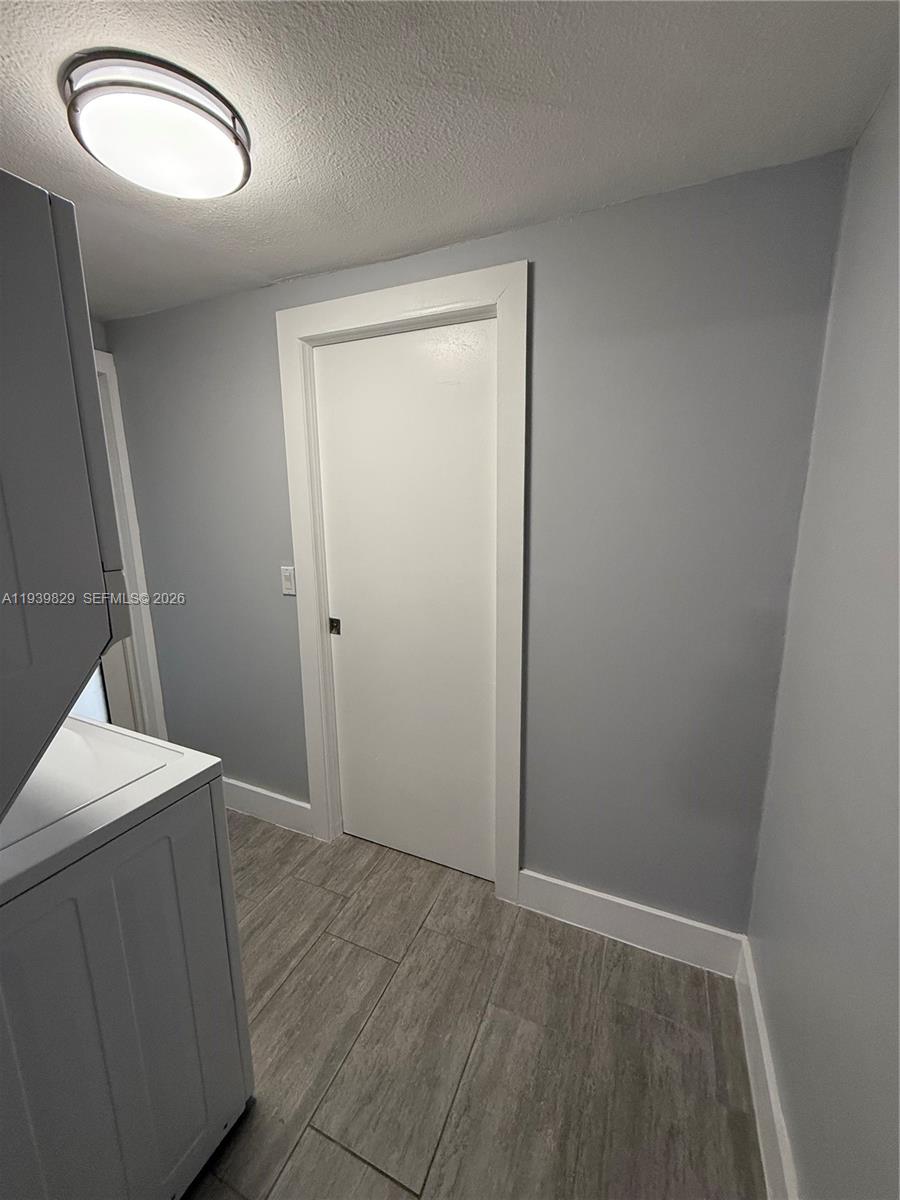 5280 Southwest 92nd Terrace Cooper City, FL 33328 - Photo 37 of 50 an empty room with wooden floor and mirror