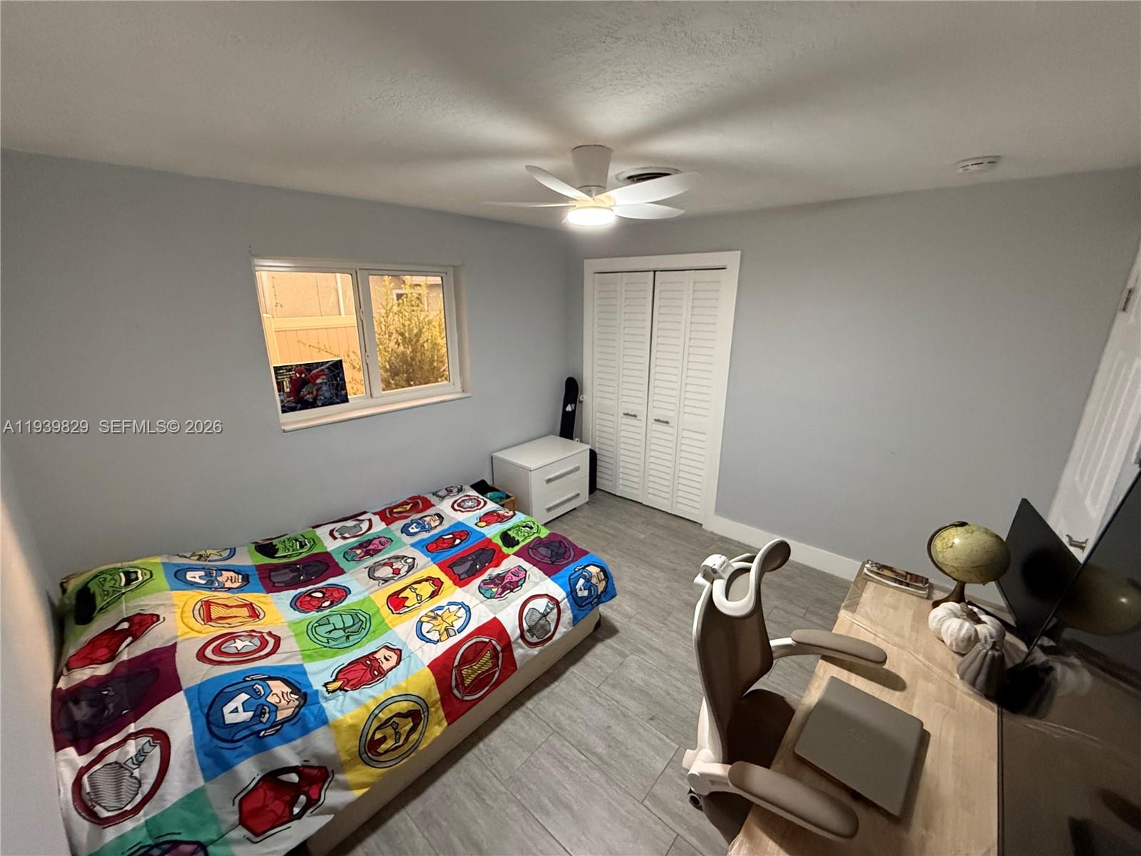 5280 Southwest 92nd Terrace Cooper City, FL 33328 - Photo 41 of 50 a bedroom with a bed and a window