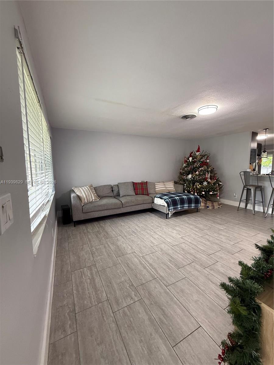 5280 Southwest 92nd Terrace Cooper City, FL 33328 - Photo 42 of 50 a living room with furniture and a window