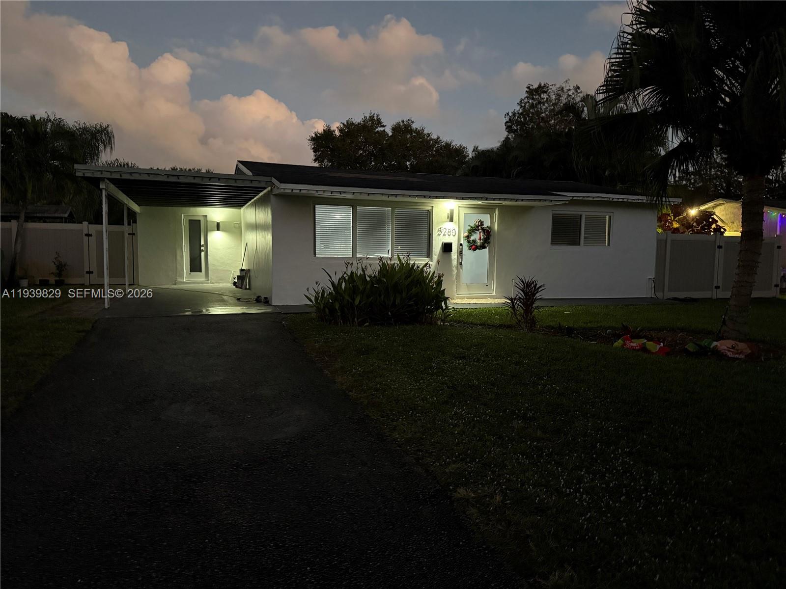 5280 Southwest 92nd Terrace Cooper City, FL 33328 - Photo 50 of 50 a front view of a house with a garden