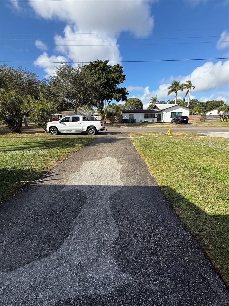 5280 Southwest 92nd Terrace Cooper City, FL 33328 - Photo 7 of 50 a view of a street with cars parked