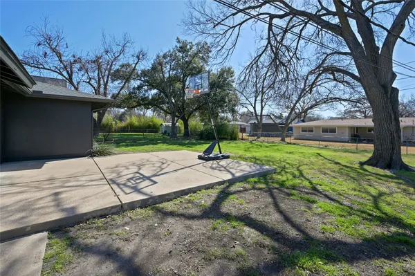 a view of a backyard with tree s
