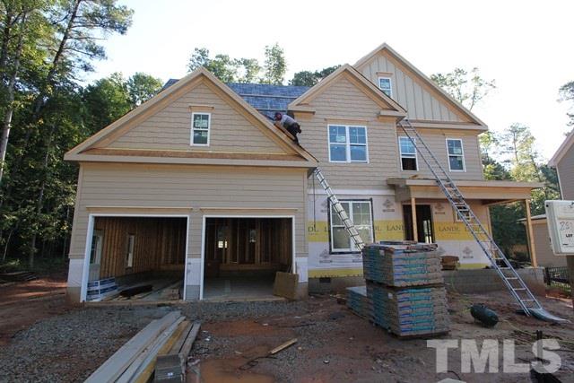 8636 Wapello Lane Raleigh, NC 27613 - Photo 1 of 21 a front view of a house with a yard