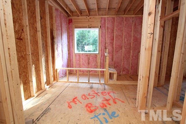8636 Wapello Lane Raleigh, NC 27613 - Photo 14 of 21 a room that has a bed and a window in it