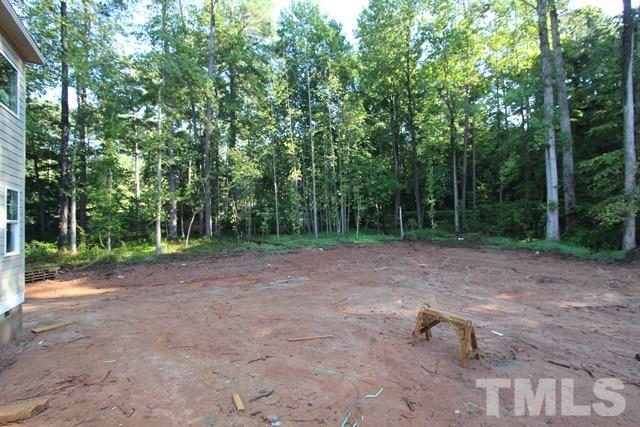8636 Wapello Lane Raleigh, NC 27613 - Photo 18 of 21 a view of a backyard with large trees