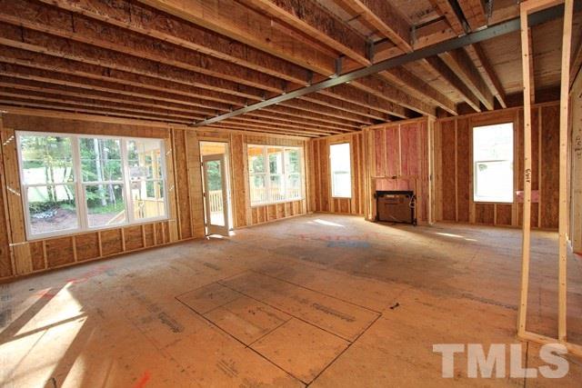 8636 Wapello Lane Raleigh, NC 27613 - Photo 3 of 21 a view of an empty room with a fireplace