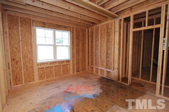 8636 Wapello Lane Raleigh, NC 27613 - Photo 10 of 21 a view of an empty room with a window