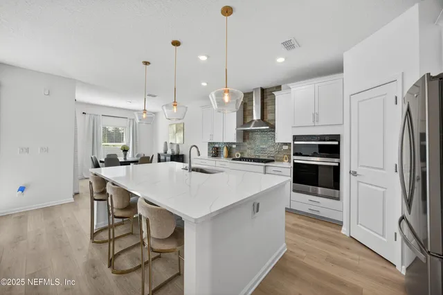 a view of a livingroom with a furniture and a ceiling fan