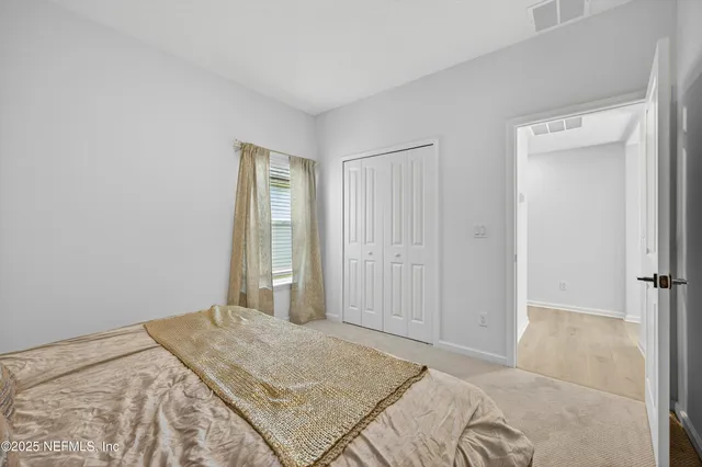 a bathroom with a double vanity sink mirror and toilet