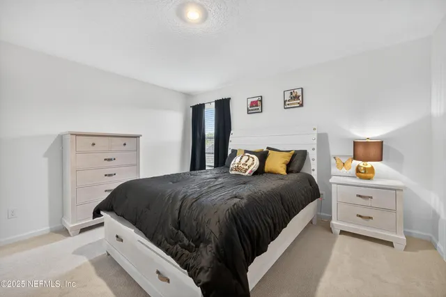 a aerial view of a house with swimming pool and yard