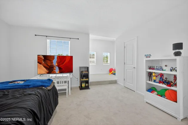 an aerial view of a house with a garden