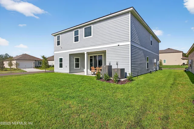a aerial view of a house with a big yard
