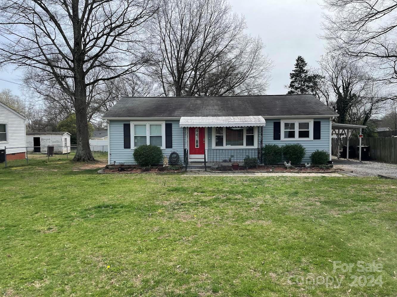 704 Union Cemetery Road Southwest Concord, NC 28027 - Photo 1 of 7 a front view of house with yard and green space