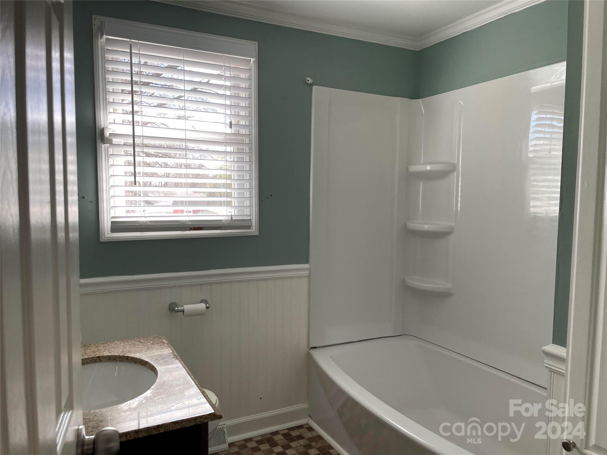 704 Union Cemetery Road Southwest Concord, NC 28027 - Photo 6 of 7 a bathroom with a granite countertop sink a toilet and shower