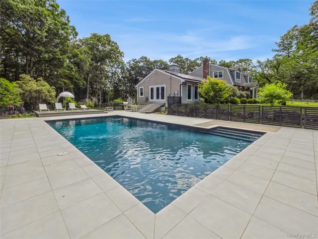 a view of a house with swimming pool