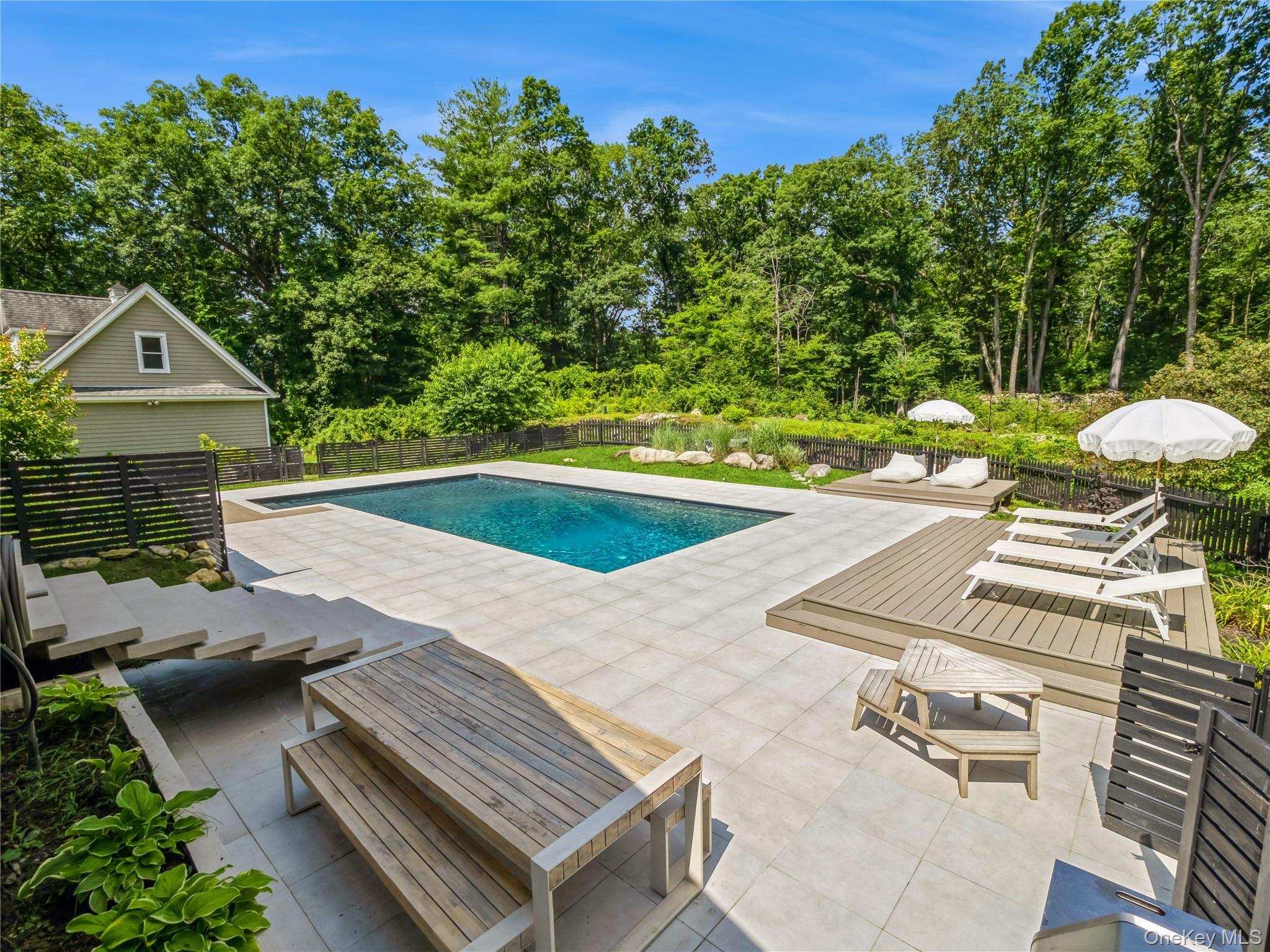 34 Hudson Ridge Garrison, NY 10524 - Photo 22 of 41 swimming pool view with a seating space