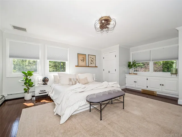a bedroom with a bed and a cabinets