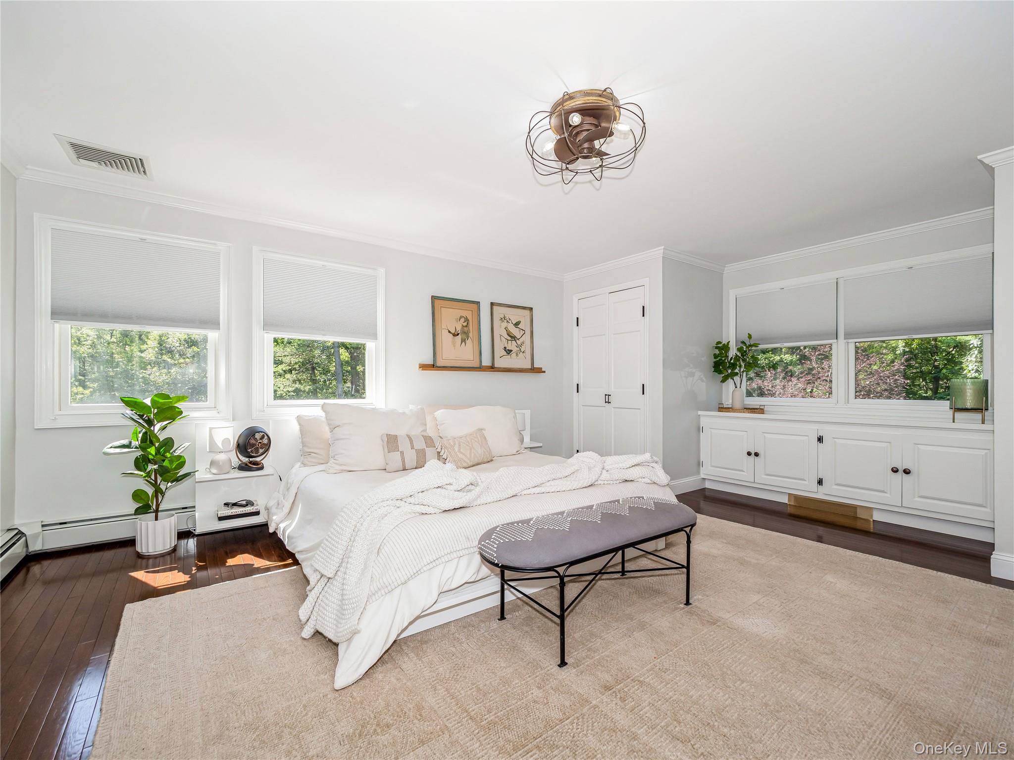 34 Hudson Ridge Garrison, NY 10524 - Photo 26 of 41 a bedroom with a bed and a chandelier