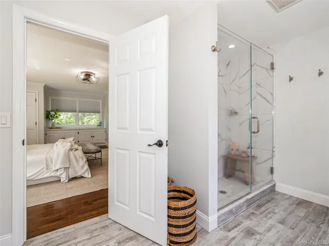 a bathroom with a double vanity sink and a mirror