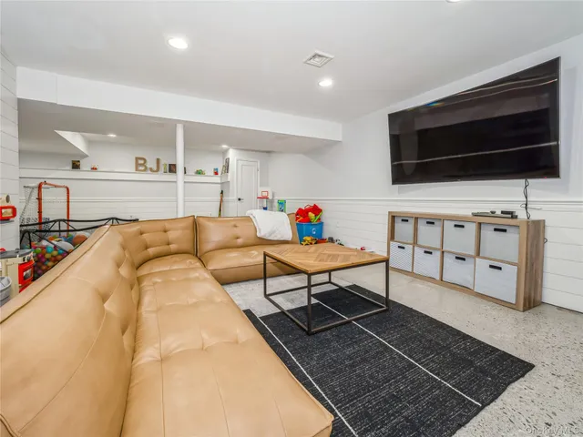 a room with gym equipment and a mirror