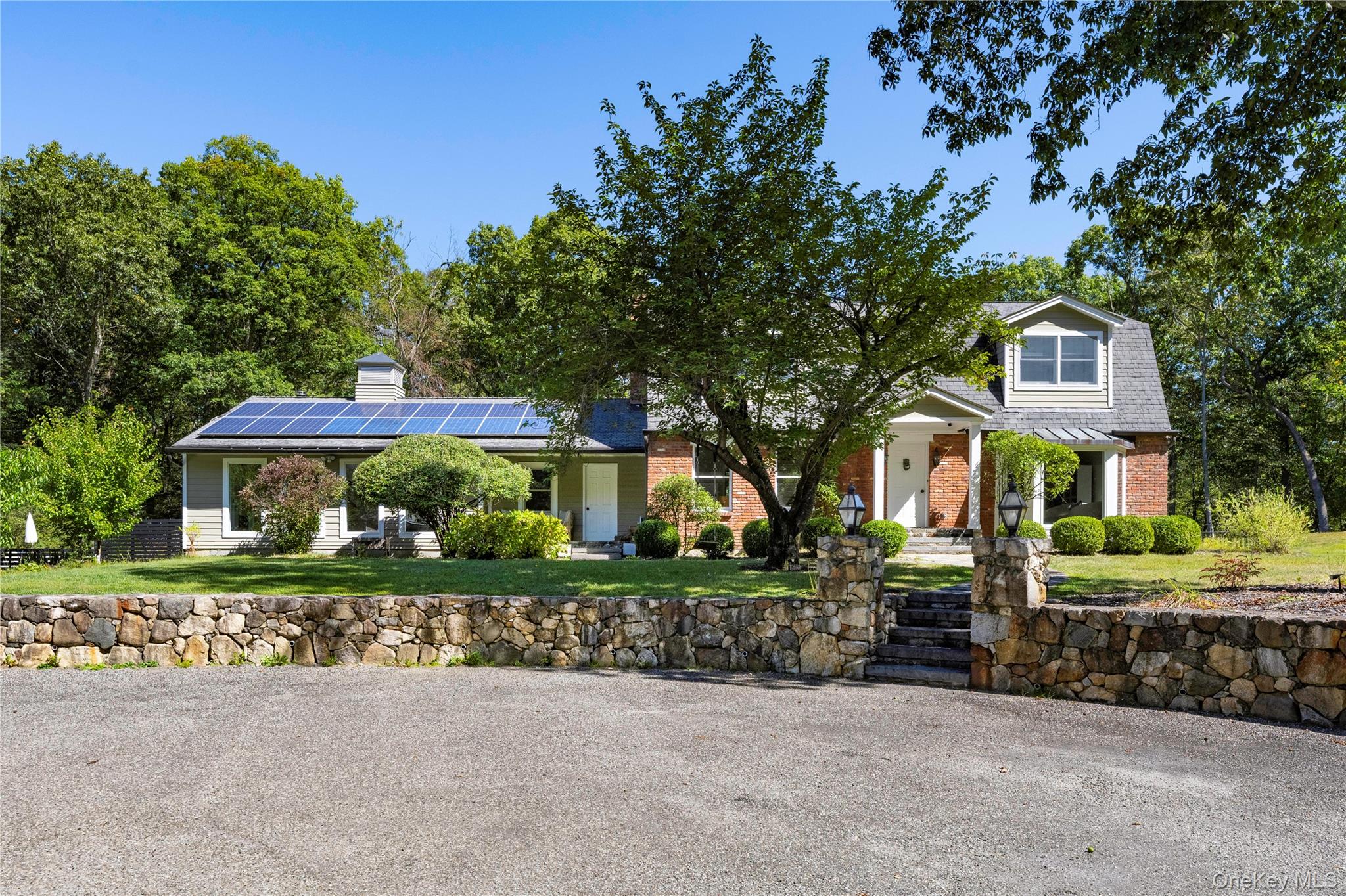 34 Hudson Ridge Garrison, NY 10524 - Photo 39 of 41 a front view of a house with a yard and garage