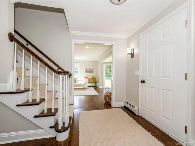 a living room with furniture window and wooden floor