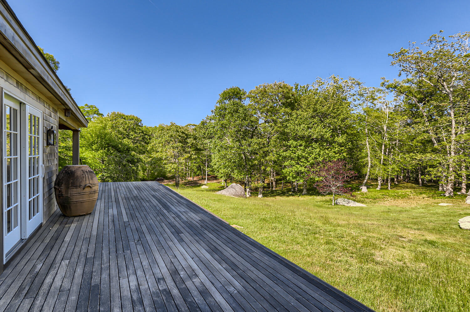 300 N Road Chilmark, MA 02535 - Photo 15 of 69 a view of a yard with wooden floor