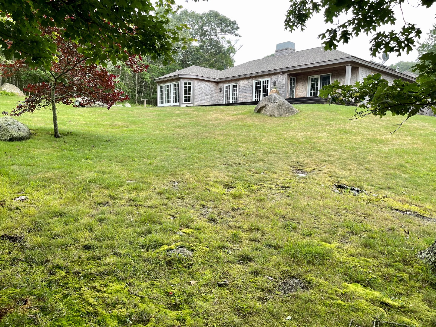 300 N Road Chilmark, MA 02535 - Photo 19 of 69 a front view of a house with a garden