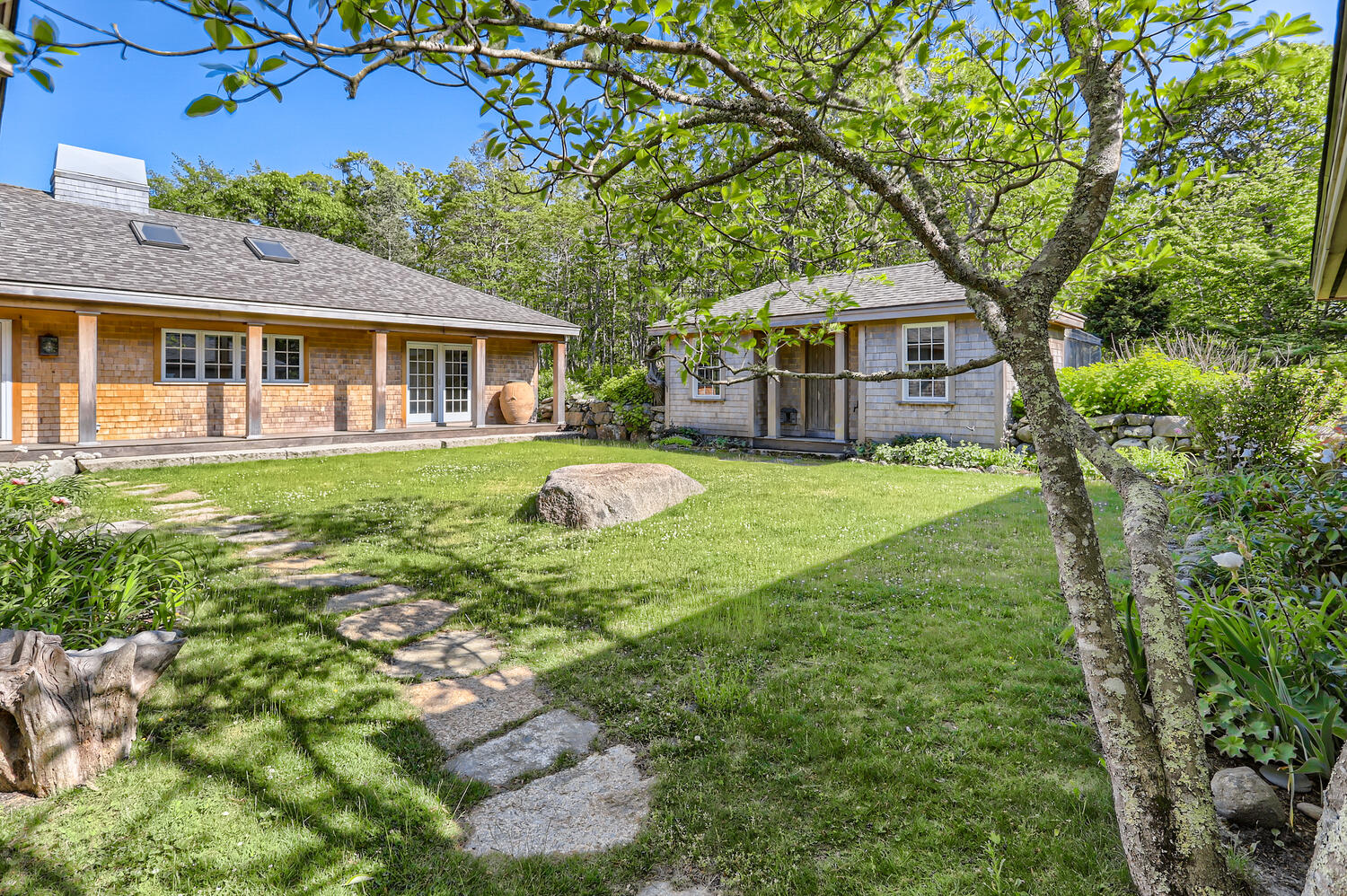 300 N Road Chilmark, MA 02535 - Photo 20 of 69 a front view of a house with a garden