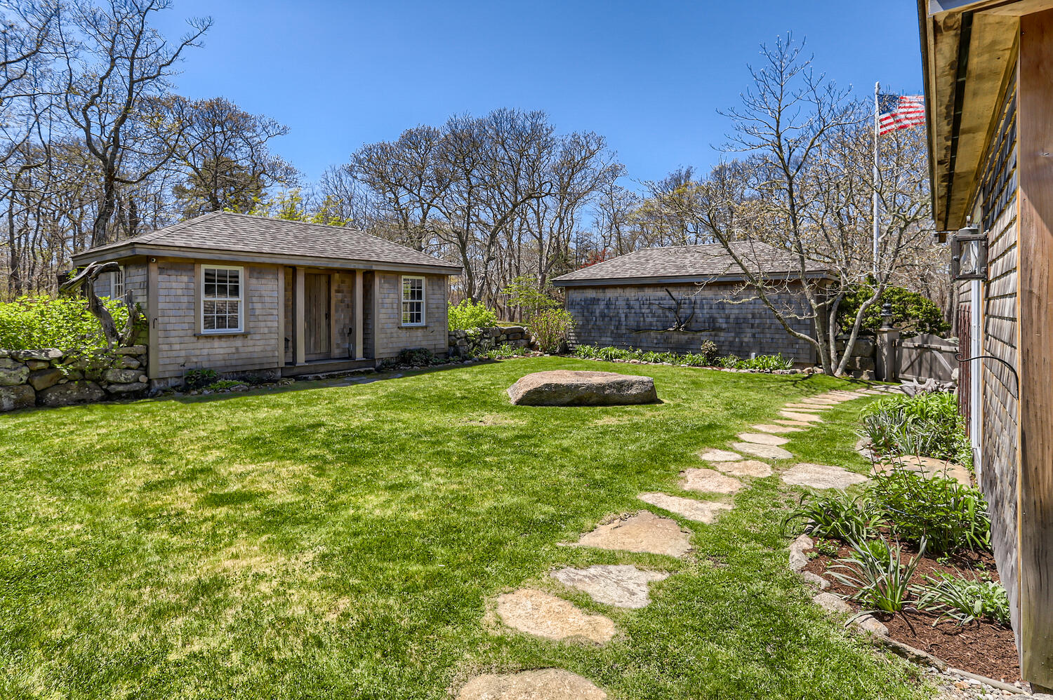 300 N Road Chilmark, MA 02535 - Photo 25 of 69 a view of a house with backyard sitting area and garden
