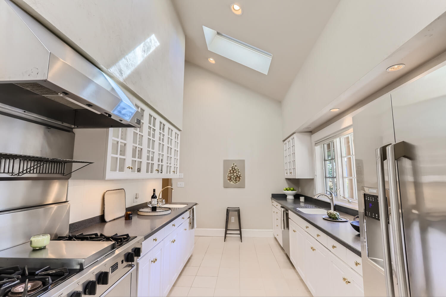 300 N Road Chilmark, MA 02535 - Photo 36 of 69 a kitchen with stainless steel appliances granite countertop a sink stove and refrigerator