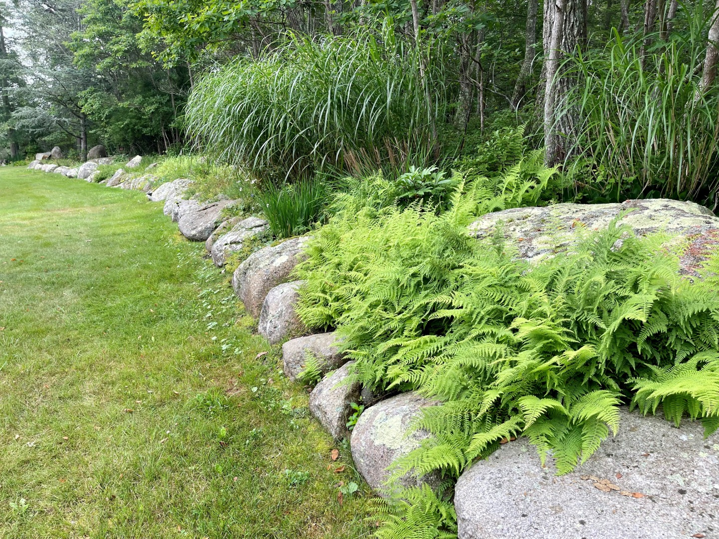 300 N Road Chilmark, MA 02535 - Photo 62 of 69 a backyard of a house with a yard and outdoor seating