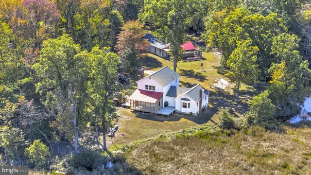 a aerial view of residential houses with yard and swimming pool