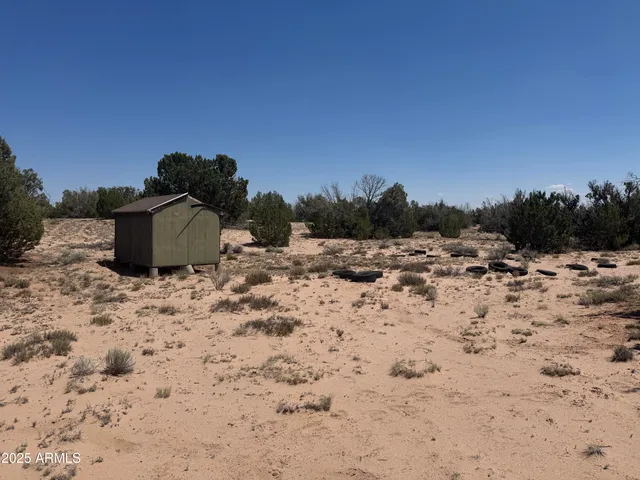 a wooden door with view of the house
