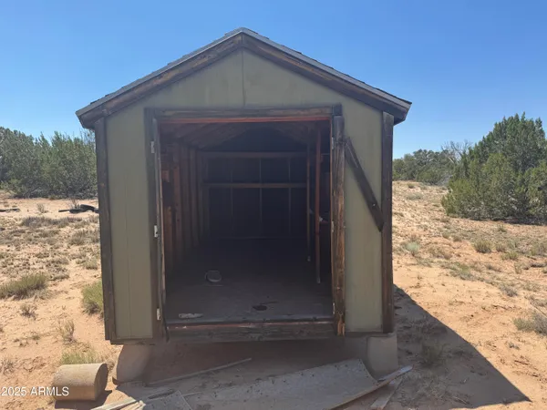 a view of a yard covered in snow