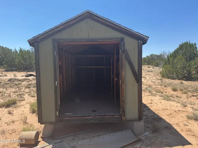 a view of a yard covered in snow