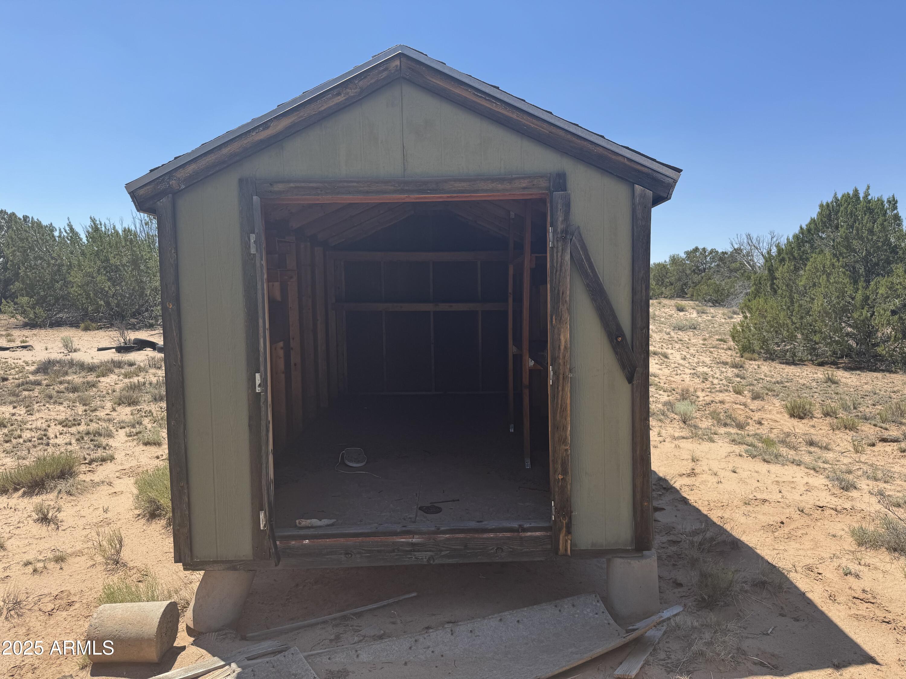 Lot 178 Red Sky Ranch, Unit 178 St. Johns, AZ 85936 - Photo 10 of 17 a wooden door with view of the house