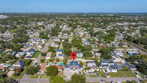 an aerial view of city and lake