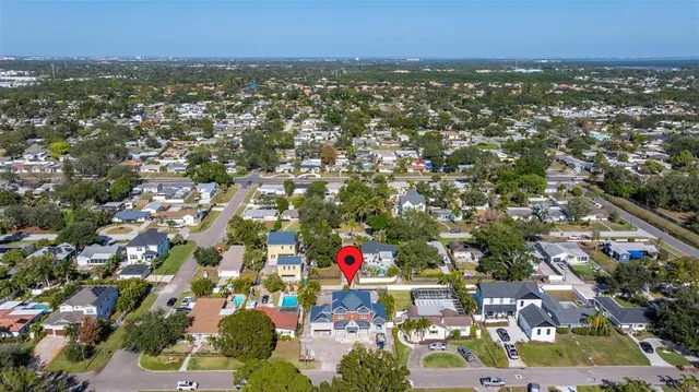 an aerial view of city and lake