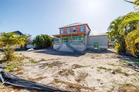 a view of a backyard of the house