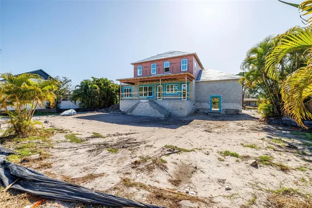 a view of a backyard of the house