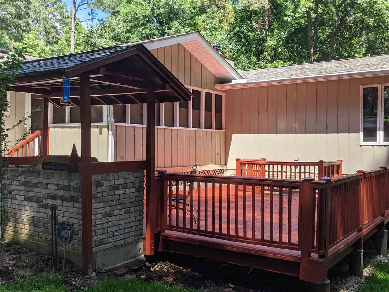 8529 Sawyer Drive Raleigh, NC 27613 - Photo 22 of 28 Large deck off the screened porch with covered grilling area. Gas grill with gas line conveys. Patio/Deck