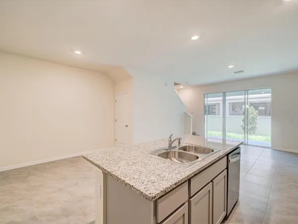 a kitchen with a sink and cabinets