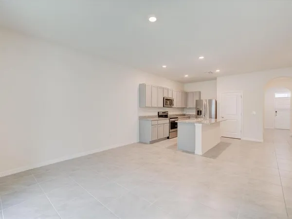 a view of kitchen with white cabinets